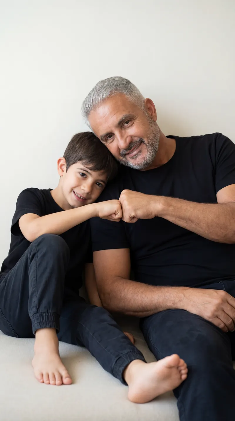 {
  "prompt": "A minimal, intimate father and son portrait…