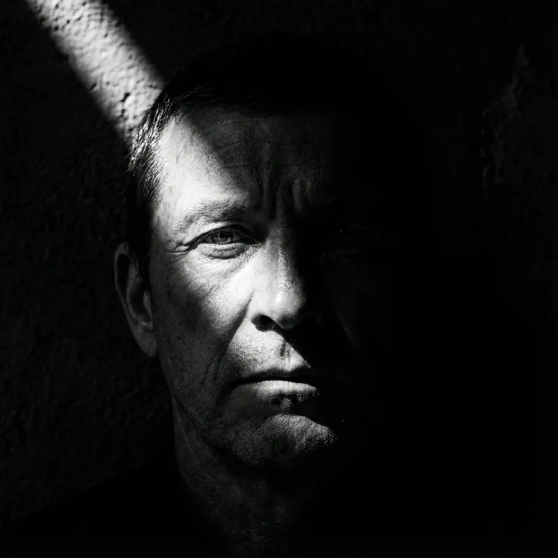 Generate an image with an intense chiaroscuro effect. The ma…